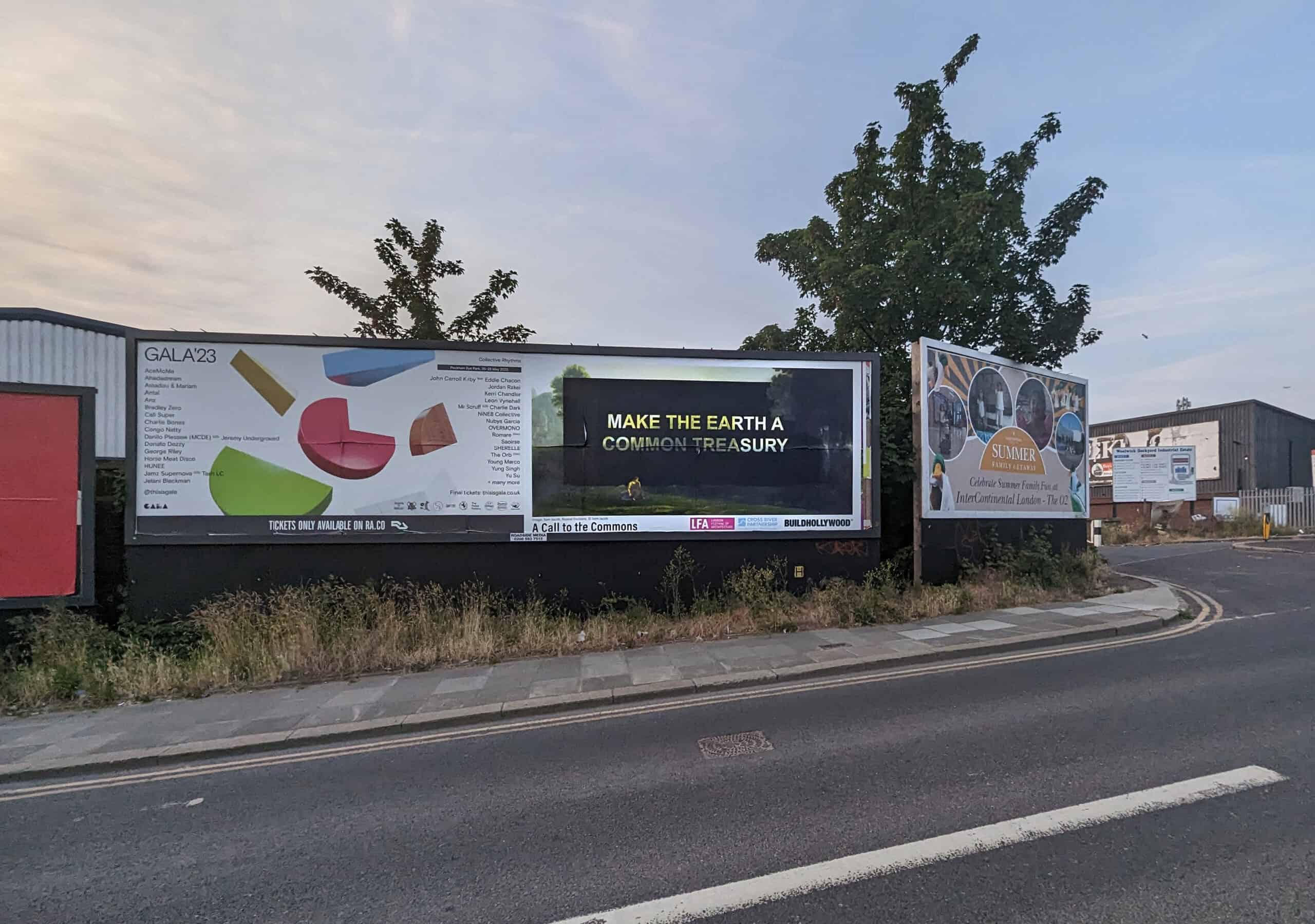 A Common Treasury billboard beside a street