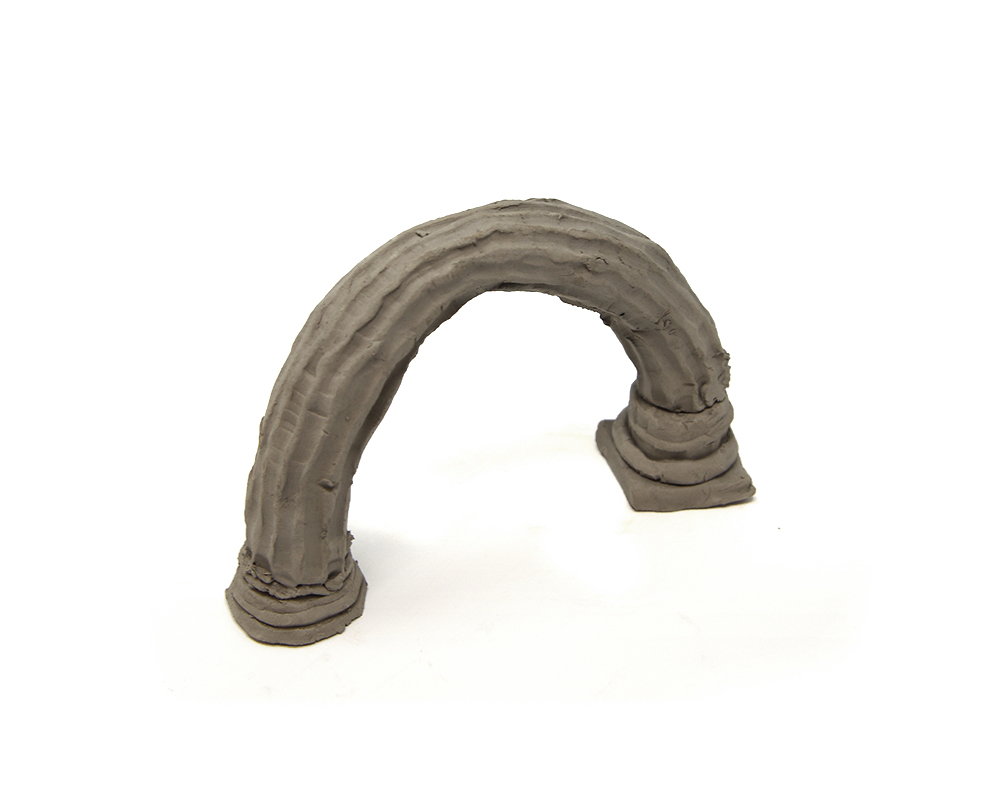 A clay column bent into a rainbow-like arch