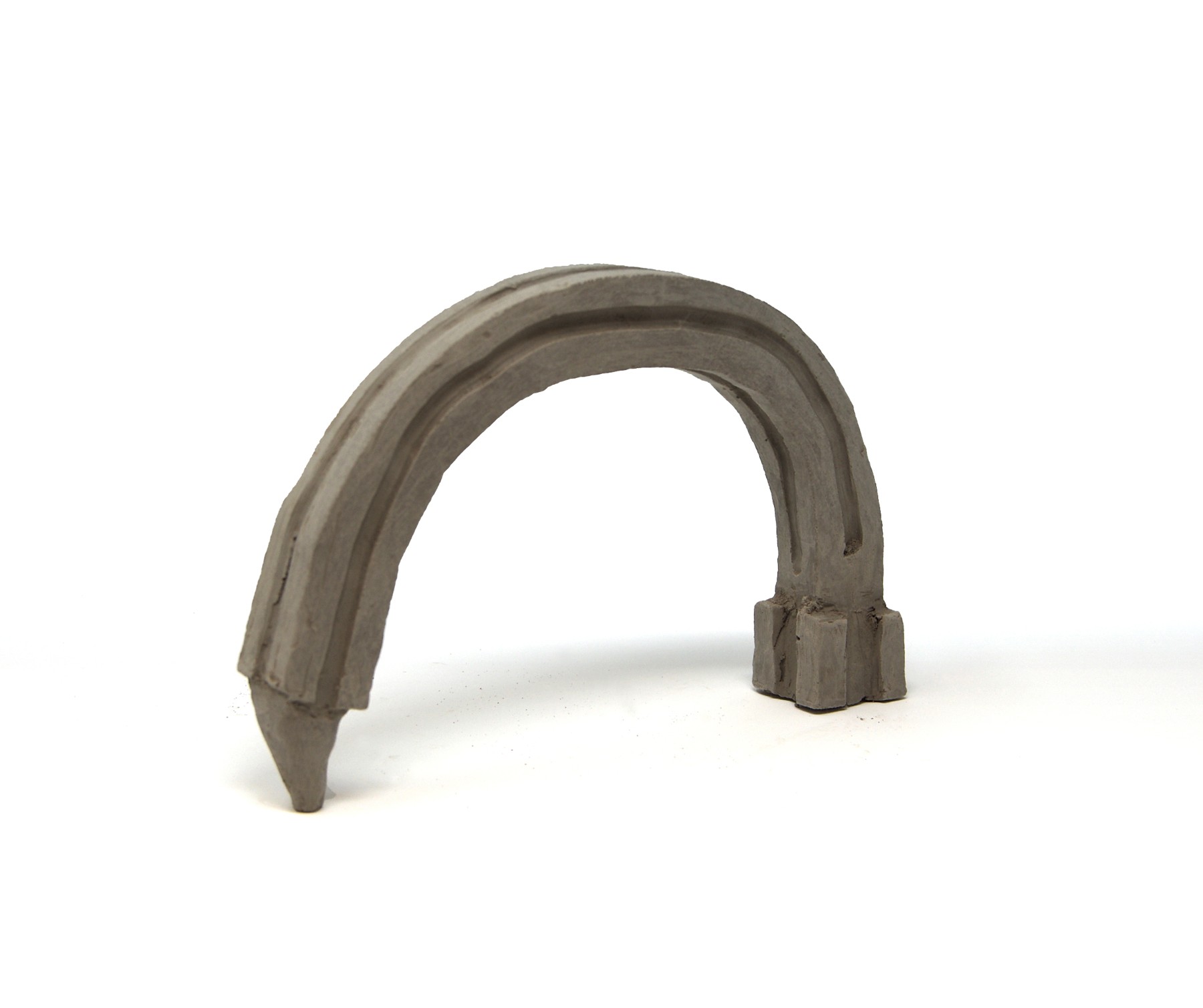A model of a stepped tower bent into an arch.