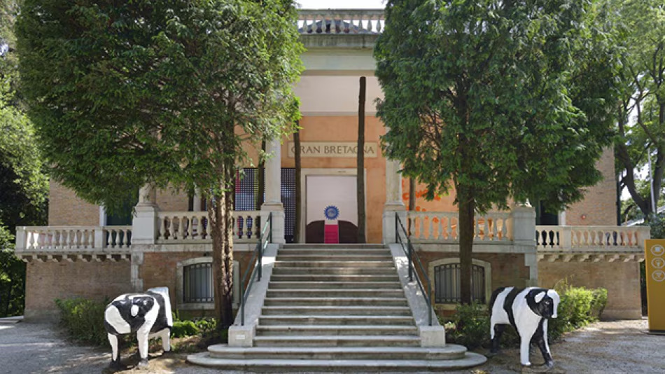The British Pavilion with two concrete cows outside its entrance.