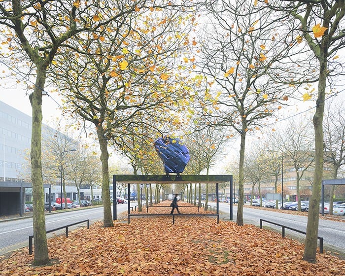 Digital Menhir above the tree-lined boulevard