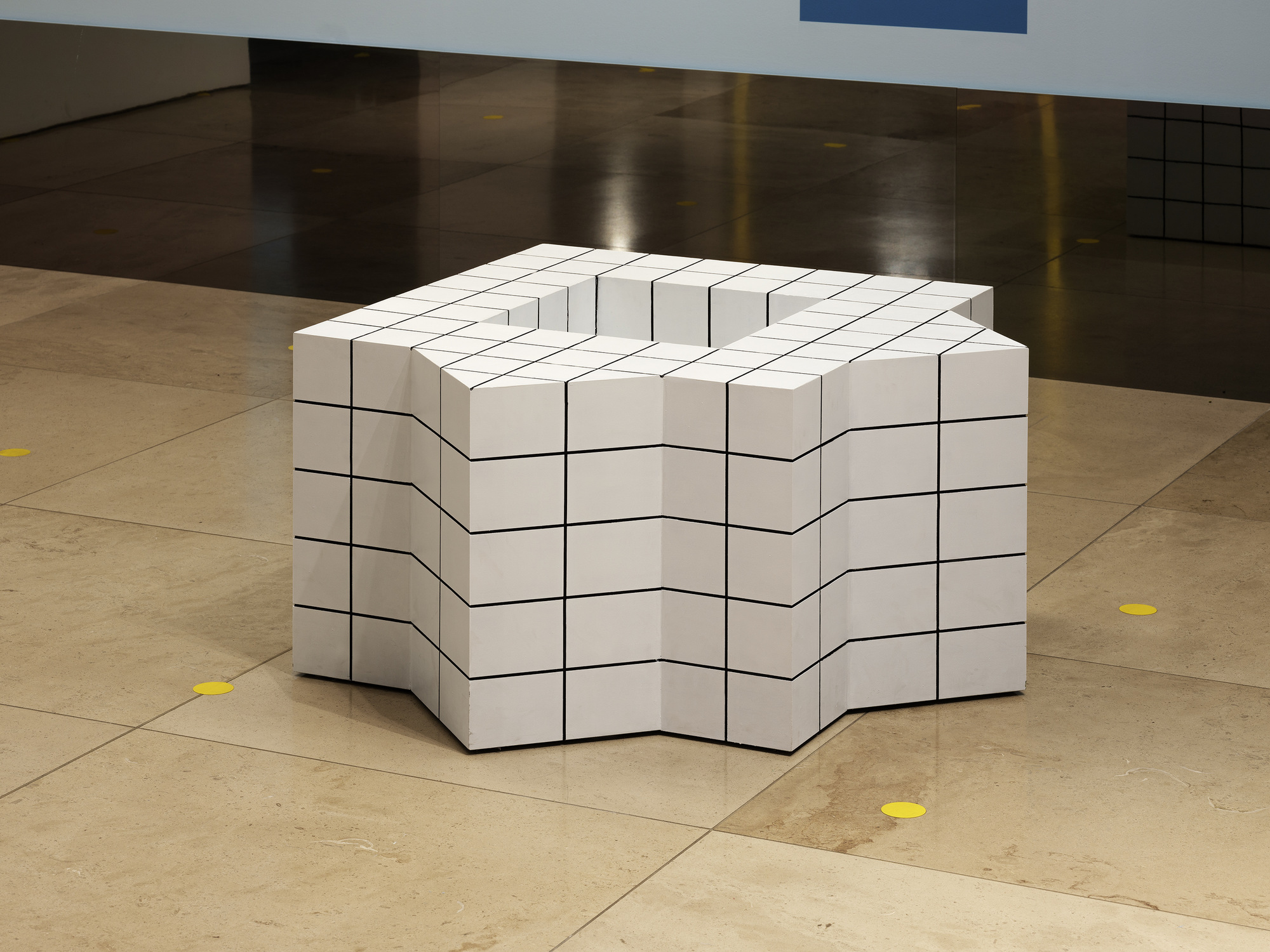 Disappear Here: White gridded seat with angular sides seen from a second viewpoint