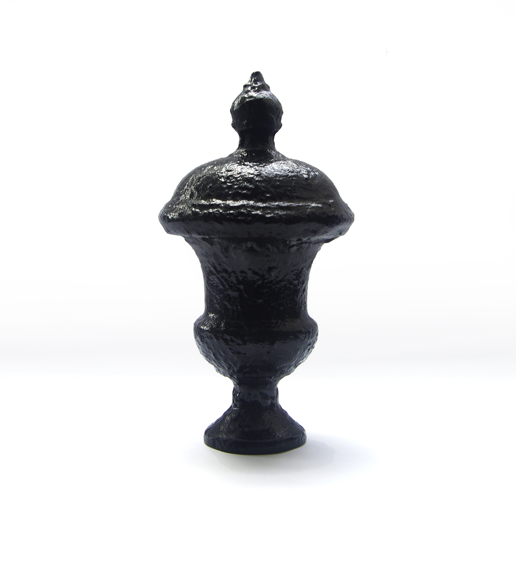 Lenin’s Urn, a black urn with a heavily textured surface on a white background