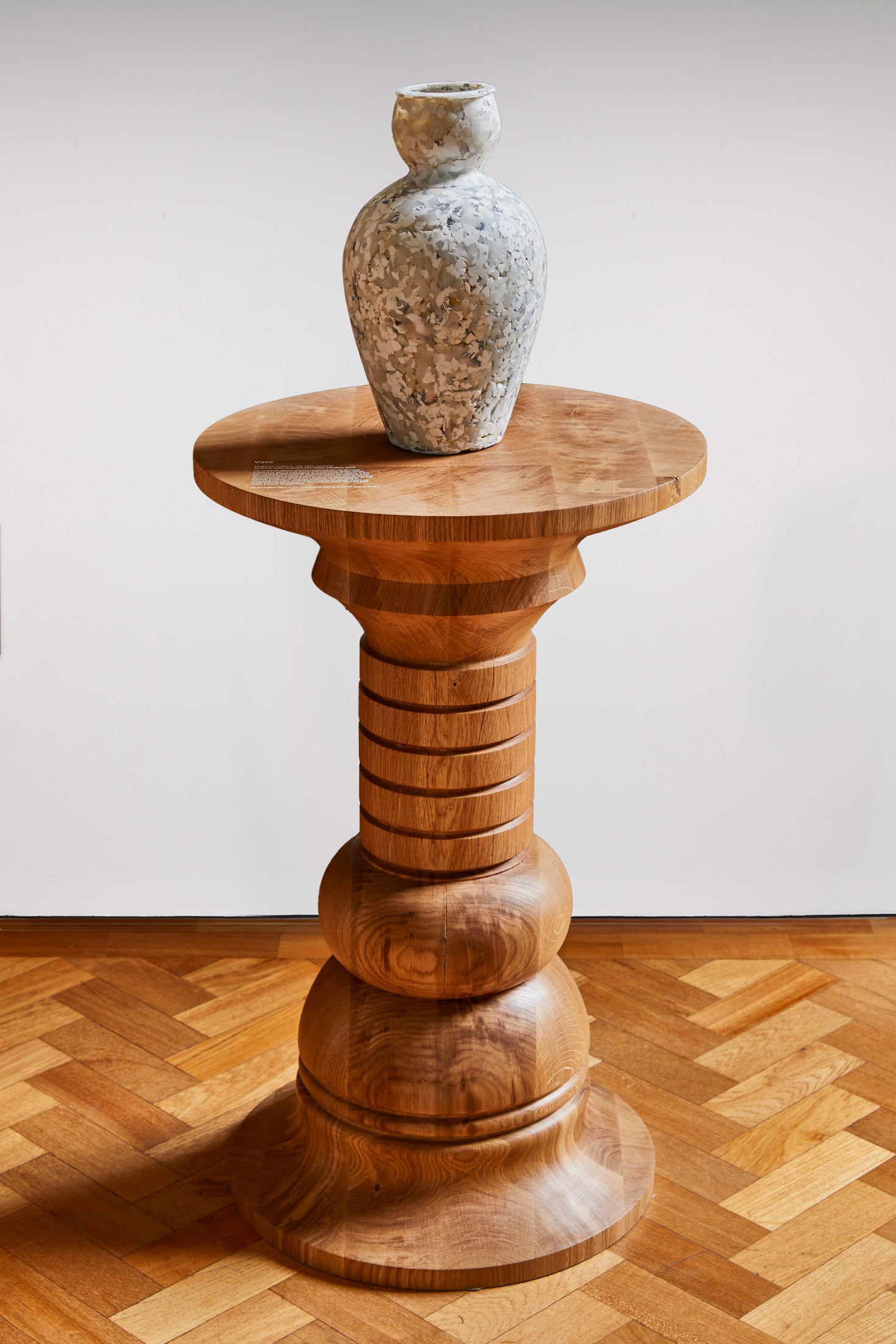 Turned table with mottled vase