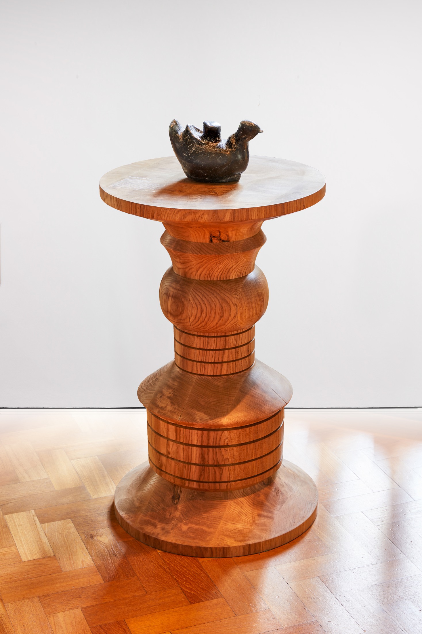 Turned table with dark bowl