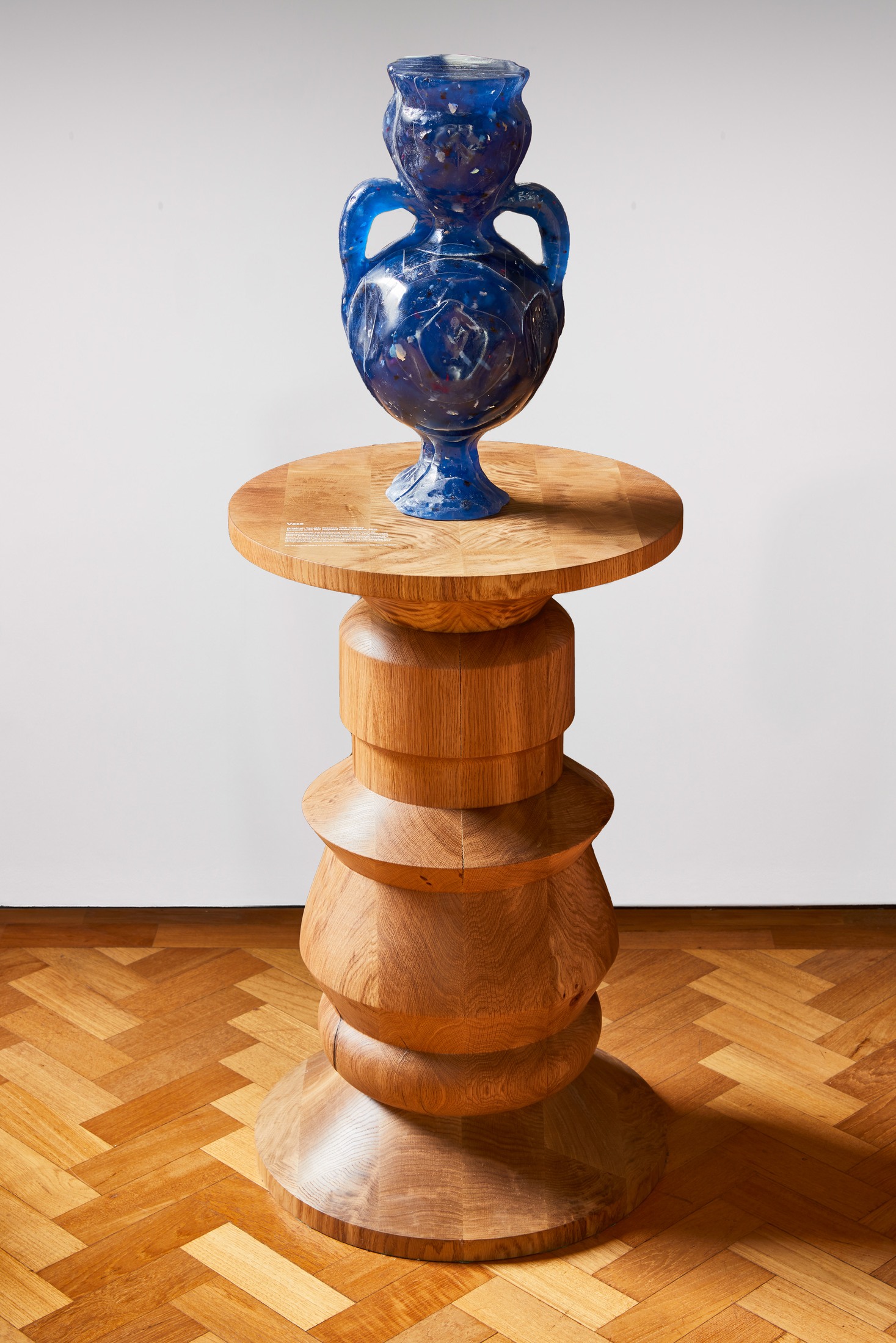 Turned table with blue vase