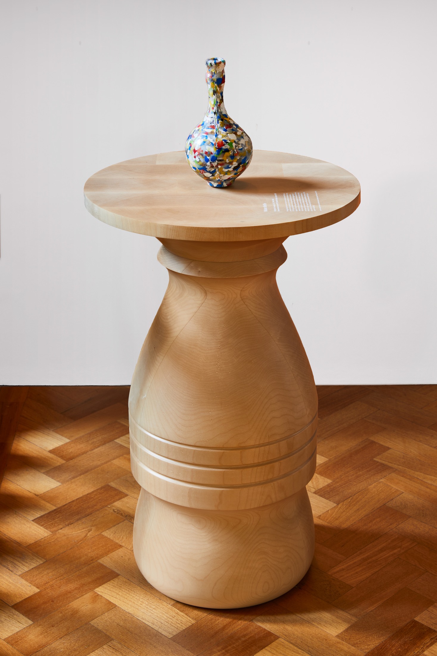 Turned table with patterned vase